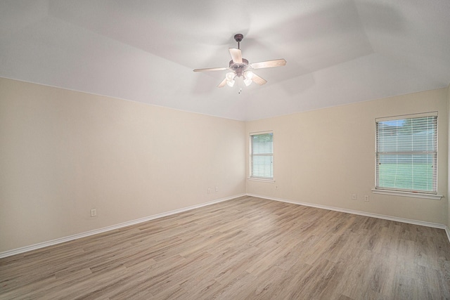 5516 La Bandera Trl, Benbrook, TX 76126 - empty room with light wood finished floors, ceiling fan, lofted ceiling, and baseboards
