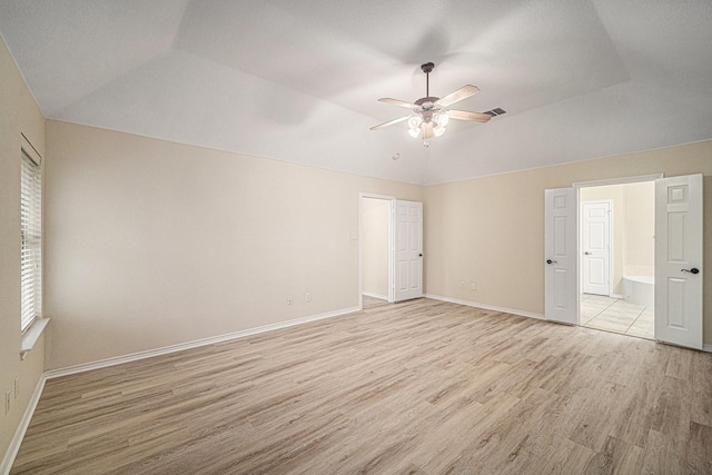 5516 La Bandera Trl, Benbrook, TX 76126 - unfurnished bedroom featuring lofted ceiling, light wood finished floors, baseboards, ensuite bath, and a ceiling fan