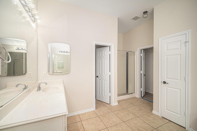 5516 La Bandera Trl, Benbrook, TX 76126 - full bath featuring double vanity, tile patterned flooring, an enclosed shower, and baseboards
