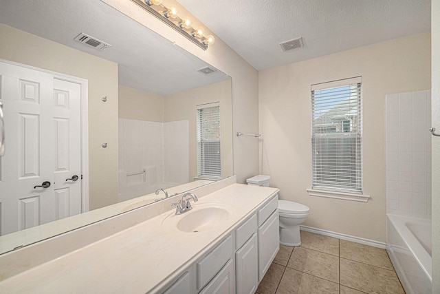 5516 La Bandera Trl, Benbrook, TX 76126 - full bathroom with toilet, vanity, baseboards, tile patterned flooring, and a textured ceiling