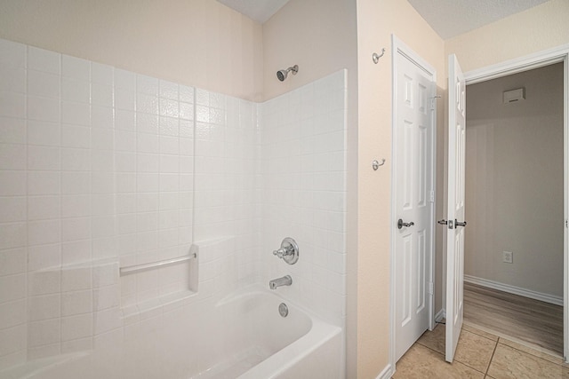 5516 La Bandera Trl, Benbrook, TX 76126 - bathroom featuring bathing tub / shower combination, tile patterned floors, and baseboards