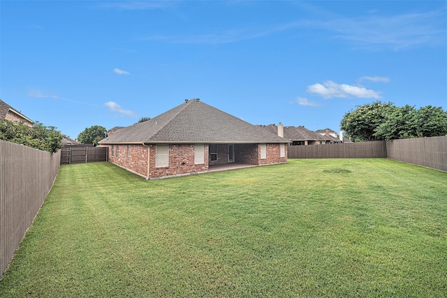 5516 La Bandera Trl, Benbrook, TX 76126 - back of property with brick siding, a shingled roof, and a patio area