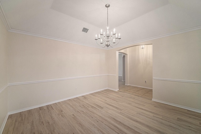5516 La Bandera Trl, Benbrook, TX 76126 - unfurnished room with arched walkways, wood finished floors, a chandelier, lofted ceiling, and baseboards
