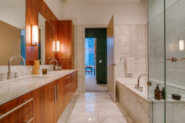 1918 N Olive St Unit 302, Dallas, TX 75201 - bathroom featuring double vanity, a bath, and marble finish flooring