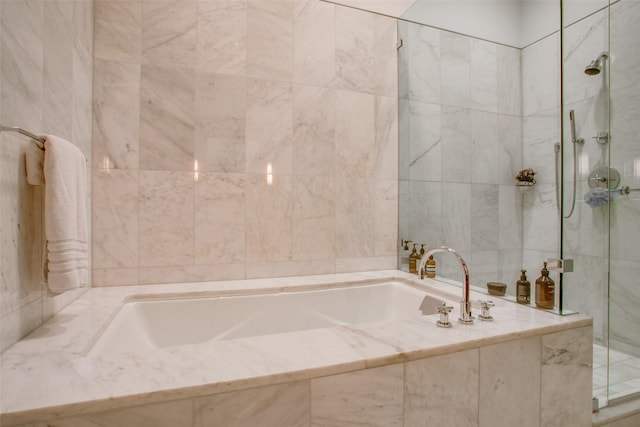 1918 N Olive St Unit 302, Dallas, TX 75201 - full bathroom featuring a bath, tiled shower, and tile walls