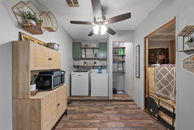 102 Creek Dr, Whitney, TX 76692 - washroom featuring separate washer and dryer, cabinet space, dark wood-type flooring, a ceiling fan, and a textured ceiling