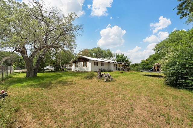 102 Creek Dr, Whitney, TX 76692 - view of yard featuring a trampoline