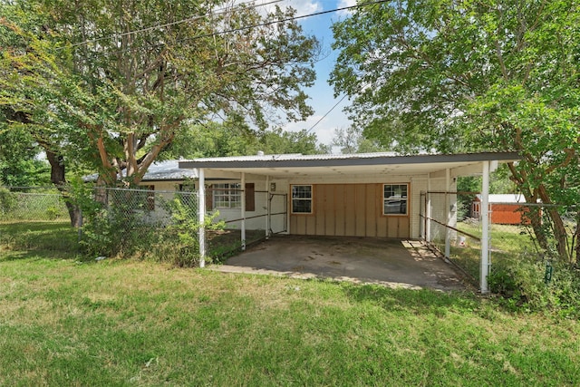 102 Creek Dr, Whitney, TX 76692 - rear view of house with an attached carport and metal roof
