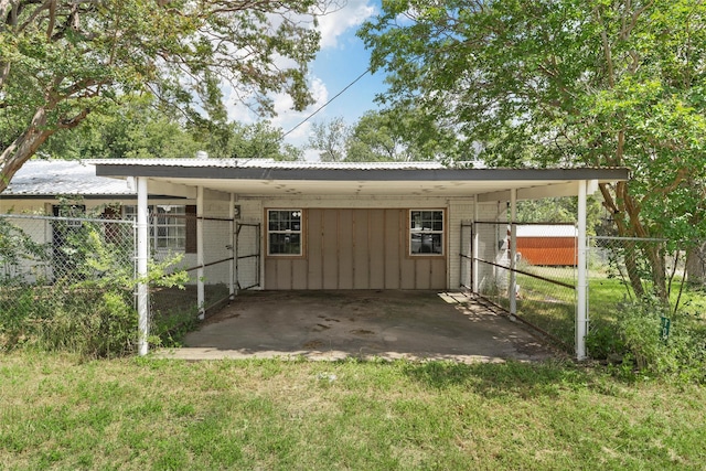 102 Creek Dr, Whitney, TX 76692 - rear view of property with a carport and metal roof