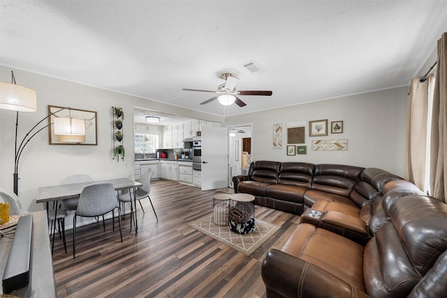 102 Creek Dr, Whitney, TX 76692 - living room with dark wood-style flooring, ceiling fan, and crown molding