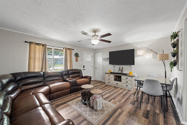 102 Creek Dr, Whitney, TX 76692 - living area with wood finished floors, ceiling fan, and a textured ceiling