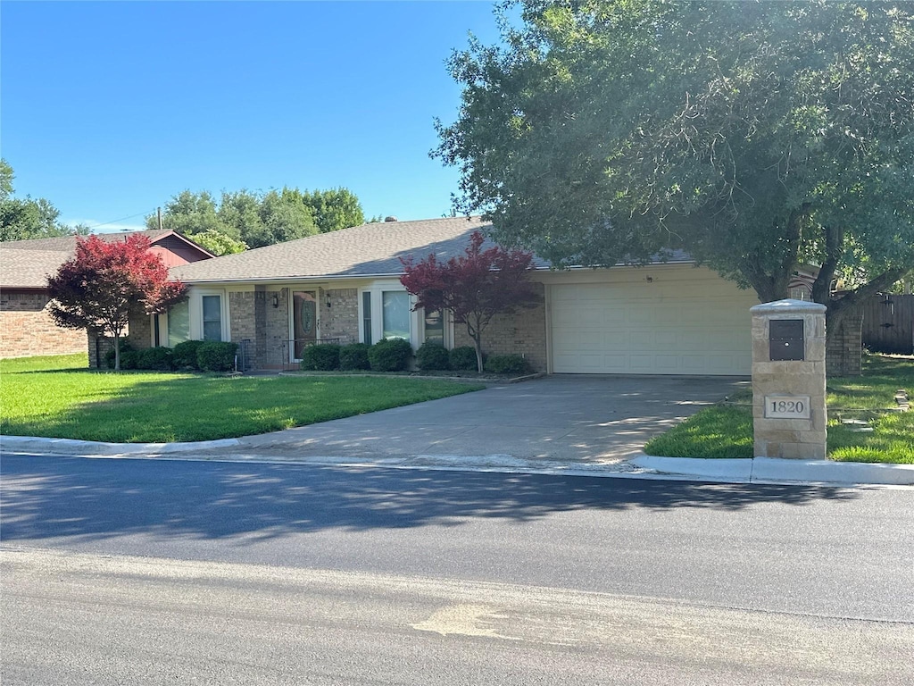1820 High Ridge Rd, Benbrook, TX 76126 - view of front of house with driveway, a garage, and a front lawn