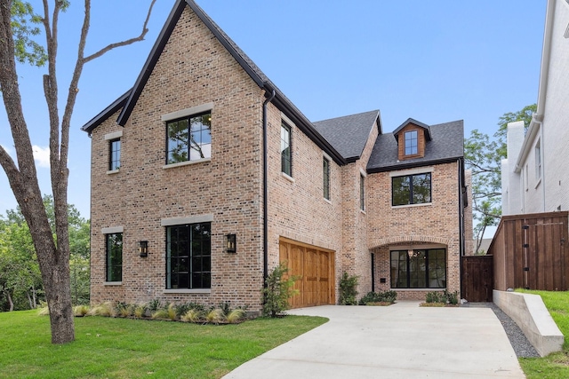 1801 Loving Ave, Dallas, TX 75214 - view of front of home with concrete driveway, brick siding, a garage, and roof with shingles