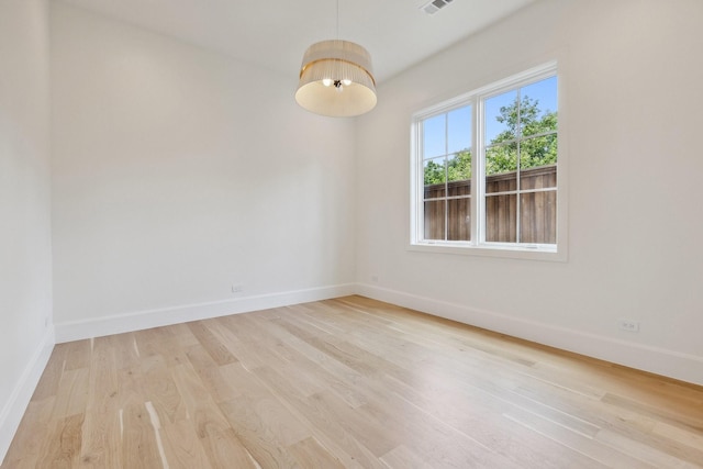 1801 Loving Ave, Dallas, TX 75214 - empty room with light wood-style floors and baseboards