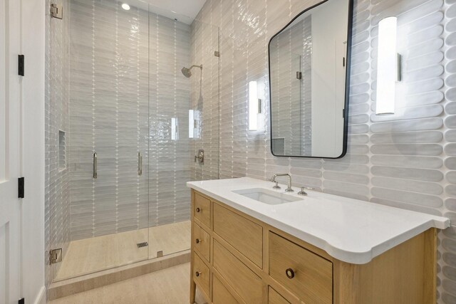 1801 Loving Ave, Dallas, TX 75214 - full bath featuring vanity, a shower stall, and tile walls