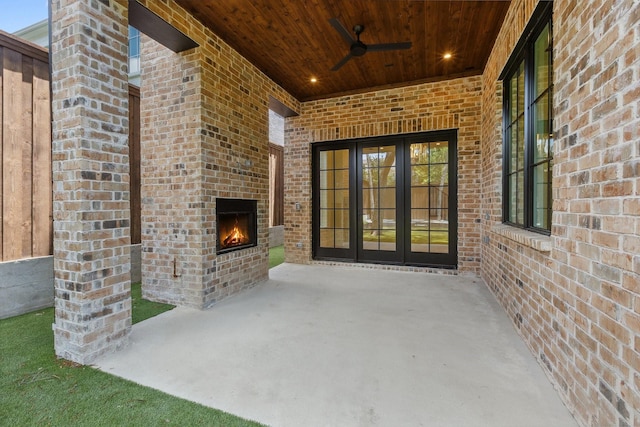 1801 Loving Ave, Dallas, TX 75214 - view of patio / terrace with an outdoor brick fireplace, a ceiling fan, and french doors