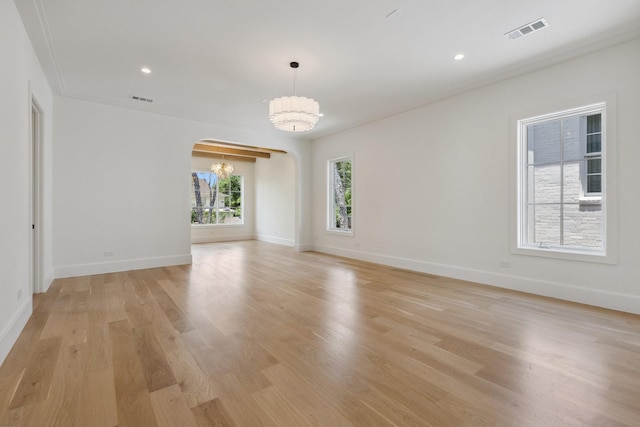 1801 Loving Ave, Dallas, TX 75214 - spare room featuring arched walkways, light wood-style floors, baseboards, and recessed lighting