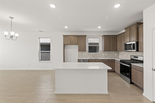 3121 Dixondale Dr, Fort Worth, TX 76108 - kitchen with stainless steel appliances, a sink, healthy amount of natural light, decorative backsplash, and recessed lighting