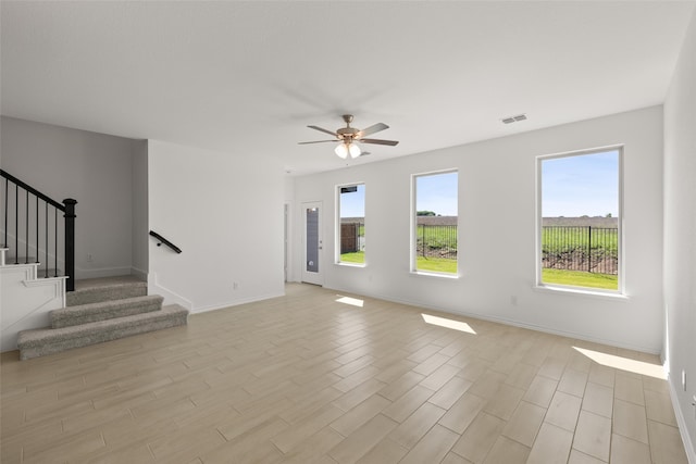 3121 Dixondale Dr, Fort Worth, TX 76108 - unfurnished living room featuring stairway, a ceiling fan, and baseboards