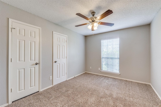 6704 Wesson Dr, Plano, TX 75023 - unfurnished bedroom featuring carpet floors, a textured ceiling, a ceiling fan, and baseboards
