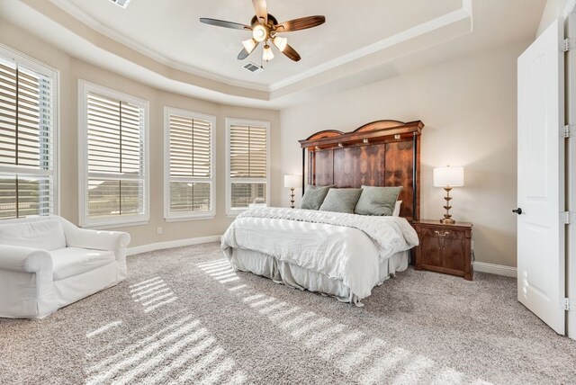 901 Jessica Ln, Prosper, TX 75078 - carpeted bedroom featuring a tray ceiling, ornamental molding, baseboards, and a ceiling fan
