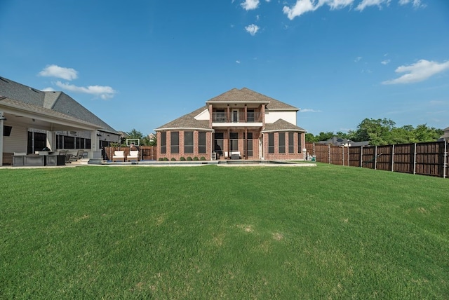 901 Jessica Ln, Prosper, TX 75078 - back of property featuring a balcony, brick siding, and a patio