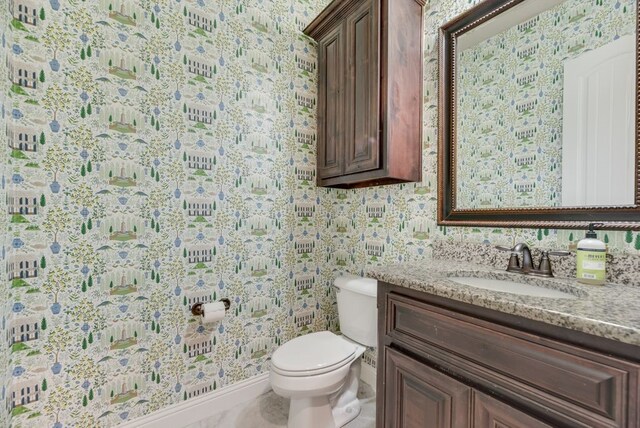 901 Jessica Ln, Prosper, TX 75078 - half bathroom with wallpapered walls, vanity, toilet, and baseboards