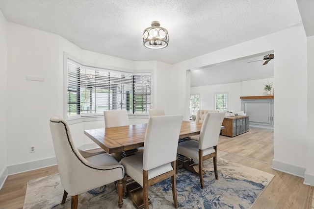 1189 W Jeter Rd, Bartonville, TX 76226 - dining area featuring light wood-style floors, a textured ceiling, and ceiling fan