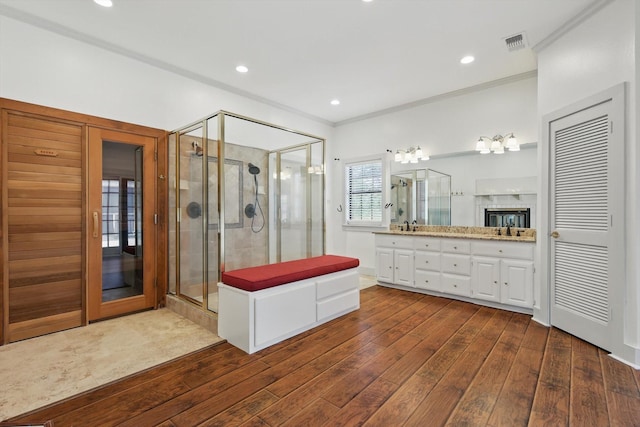 1189 W Jeter Rd, Bartonville, TX 76226 - full bath featuring double vanity, hardwood / wood-style floors, a shower stall, crown molding, and recessed lighting