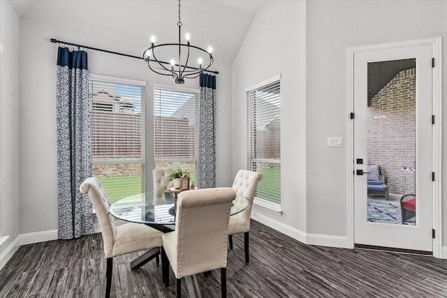 1015 Sable Dr, Rockwall, TX 75087 - dining area with a chandelier, vaulted ceiling, dark wood finished floors, and baseboards
