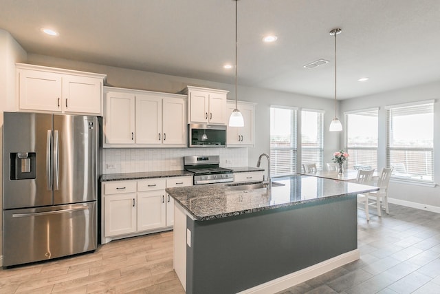 812 Holler Loop, Fort Worth, TX 76247 - kitchen featuring appliances with stainless steel finishes, a sink, tasteful backsplash, white cabinetry, and recessed lighting