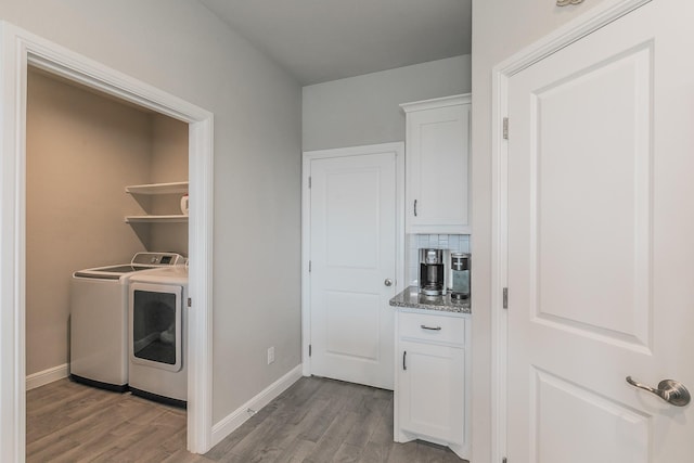 812 Holler Loop, Fort Worth, TX 76247 - washroom with separate washer and dryer, light wood-style floors, and baseboards