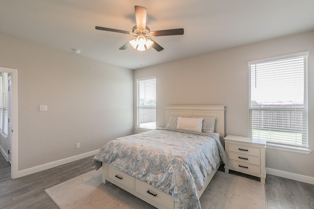 812 Holler Loop, Fort Worth, TX 76247 - bedroom with baseboards, wood finished floors, and a ceiling fan