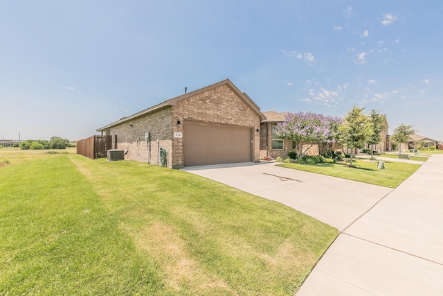 812 Holler Loop, Fort Worth, TX 76247 - view of front of home with brick siding, an attached garage, driveway, and cooling unit