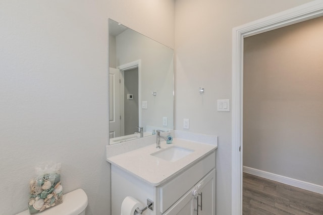812 Holler Loop, Fort Worth, TX 76247 - half bath with toilet, vanity, wood finished floors, and baseboards