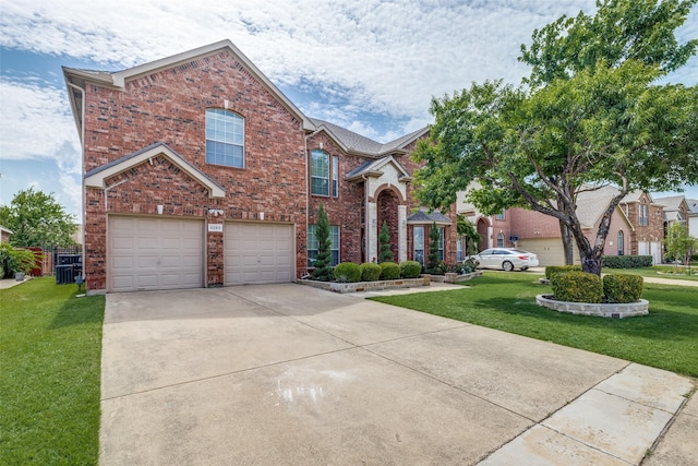 5283 W Cove Way, Grand Prairie, TX 75052 - traditional-style home featuring brick siding, a front yard, and a garage