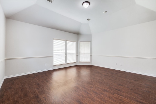 5283 W Cove Way, Grand Prairie, TX 75052 - empty room with vaulted ceiling, wood finished floors, and baseboards