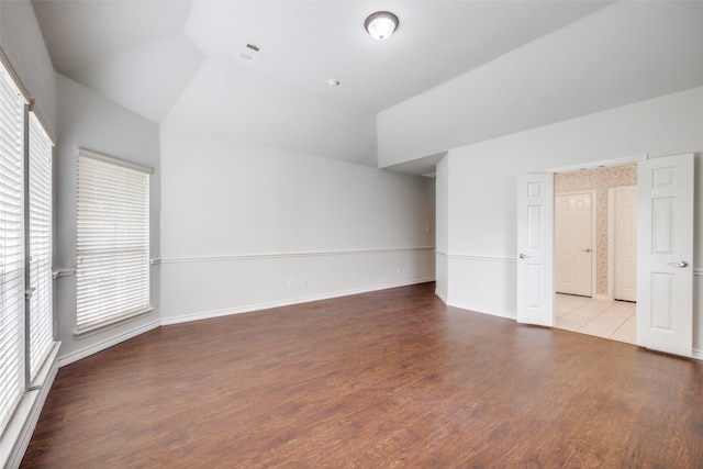 5283 W Cove Way, Grand Prairie, TX 75052 - unfurnished room featuring vaulted ceiling, wood finished floors, and baseboards