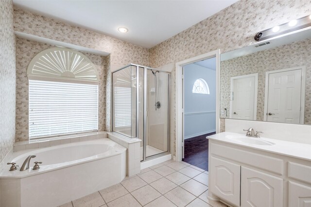 5283 W Cove Way, Grand Prairie, TX 75052 - full bathroom with tile patterned floors, a shower stall, plenty of natural light, and wallpapered walls