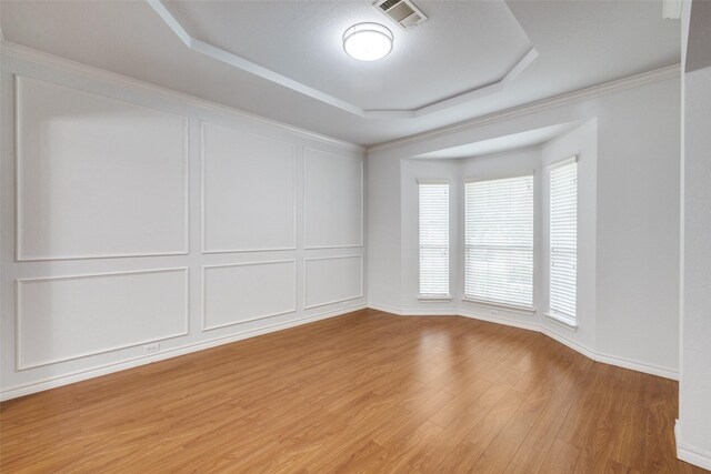 5283 W Cove Way, Grand Prairie, TX 75052 - unfurnished room with a raised ceiling, light wood-style floors, and baseboards