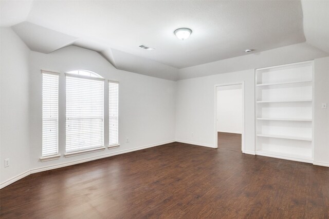 5283 W Cove Way, Grand Prairie, TX 75052 - spare room featuring dark wood-style floors, built in features, baseboards, and lofted ceiling