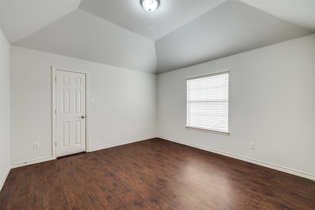5283 W Cove Way, Grand Prairie, TX 75052 - empty room with vaulted ceiling, dark wood-type flooring, and baseboards