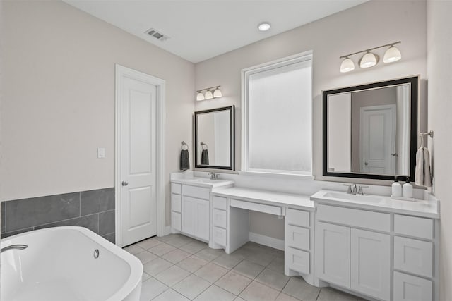 1720 Rolling Heights Ln, Fort Worth, TX 76008 - full bathroom featuring a soaking tub, double vanity, tile patterned floors, and baseboards