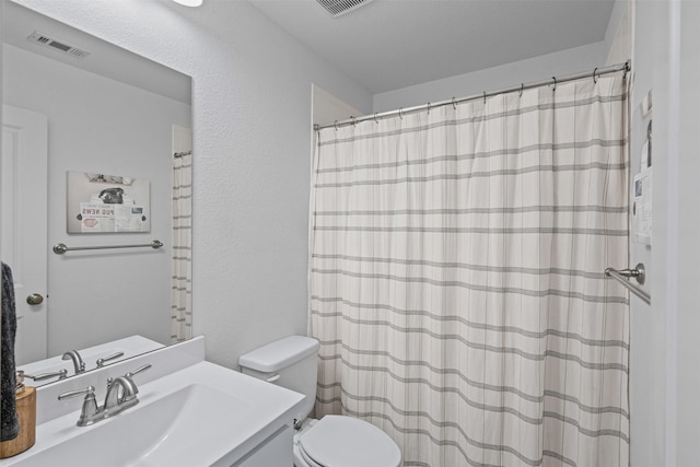 1720 Rolling Heights Ln, Fort Worth, TX 76008 - full bathroom featuring toilet, vanity, a textured wall, and a shower with shower curtain