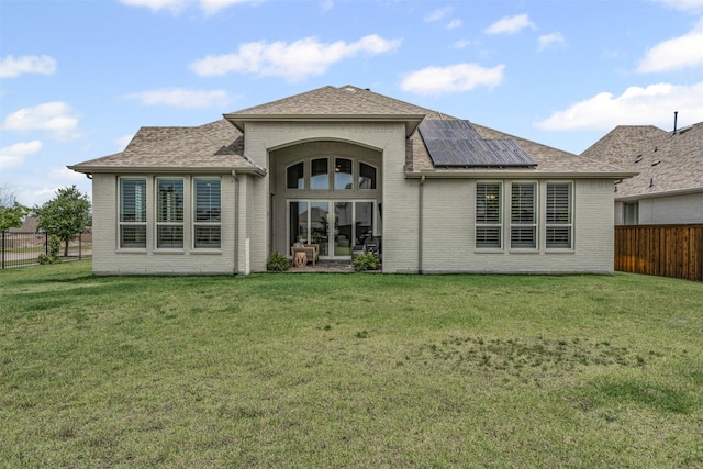 1720 Rolling Heights Ln, Fort Worth, TX 76008 - back of property featuring roof mounted solar panels, brick siding, and roof with shingles