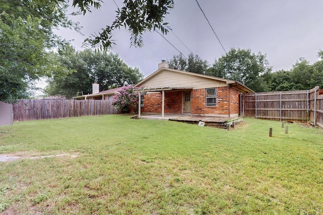 8512 Whitney Dr, White Settlement, TX 76108 - back of house with brick siding, a chimney, and a patio