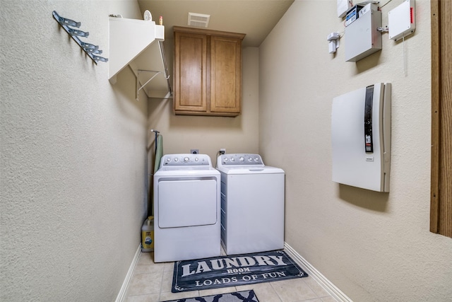 105 Cassandra Dr, Forney, TX 75126 - laundry area with cabinet space, washer and dryer, baseboards, and light tile patterned floors