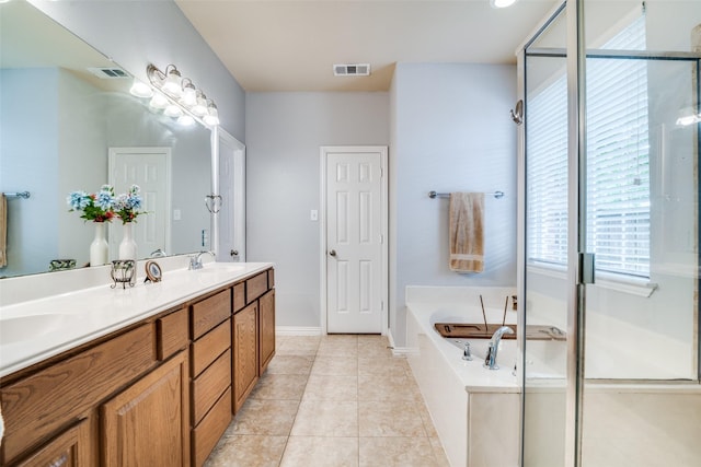 105 Cassandra Dr, Forney, TX 75126 - full bathroom with double vanity, a garden tub, tile patterned floors, and baseboards