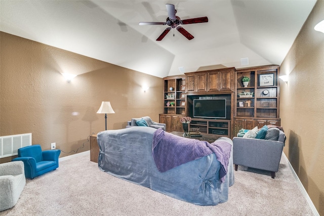 105 Cassandra Dr, Forney, TX 75126 - living area featuring carpet flooring, a textured wall, lofted ceiling, ceiling fan, and baseboards
