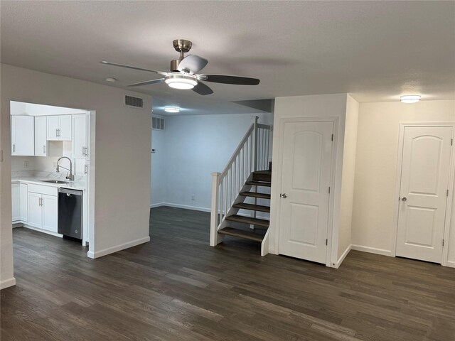 14800 Enterprise Dr Unit 17B, Farmers Branch, TX 75234 - unfurnished living room with stairs, a sink, dark wood finished floors, ceiling fan, and baseboards